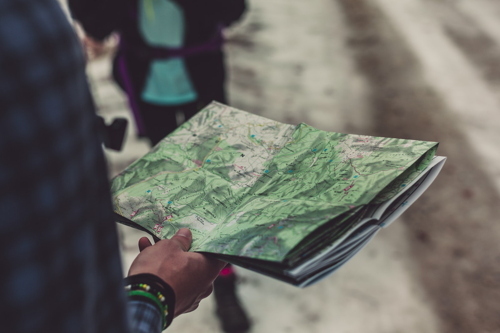 Person Holding Outlined Map